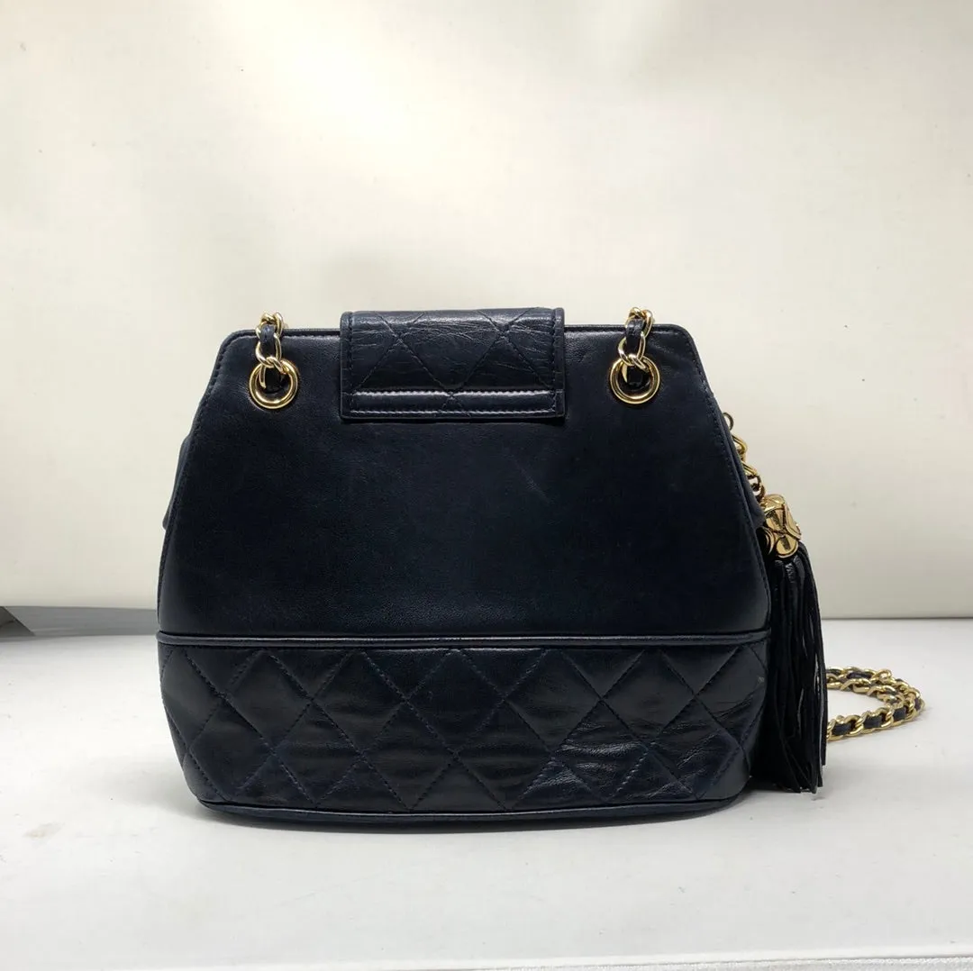 Vintage: Chanel navy lambskin top flab shoulder bag with gold hardware and tassle