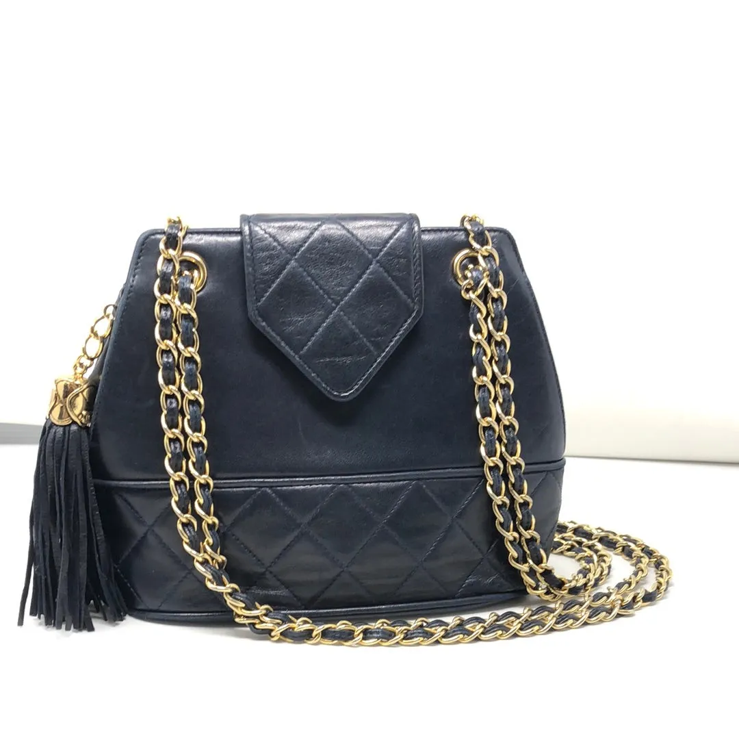 Vintage: Chanel navy lambskin top flab shoulder bag with gold hardware and tassle