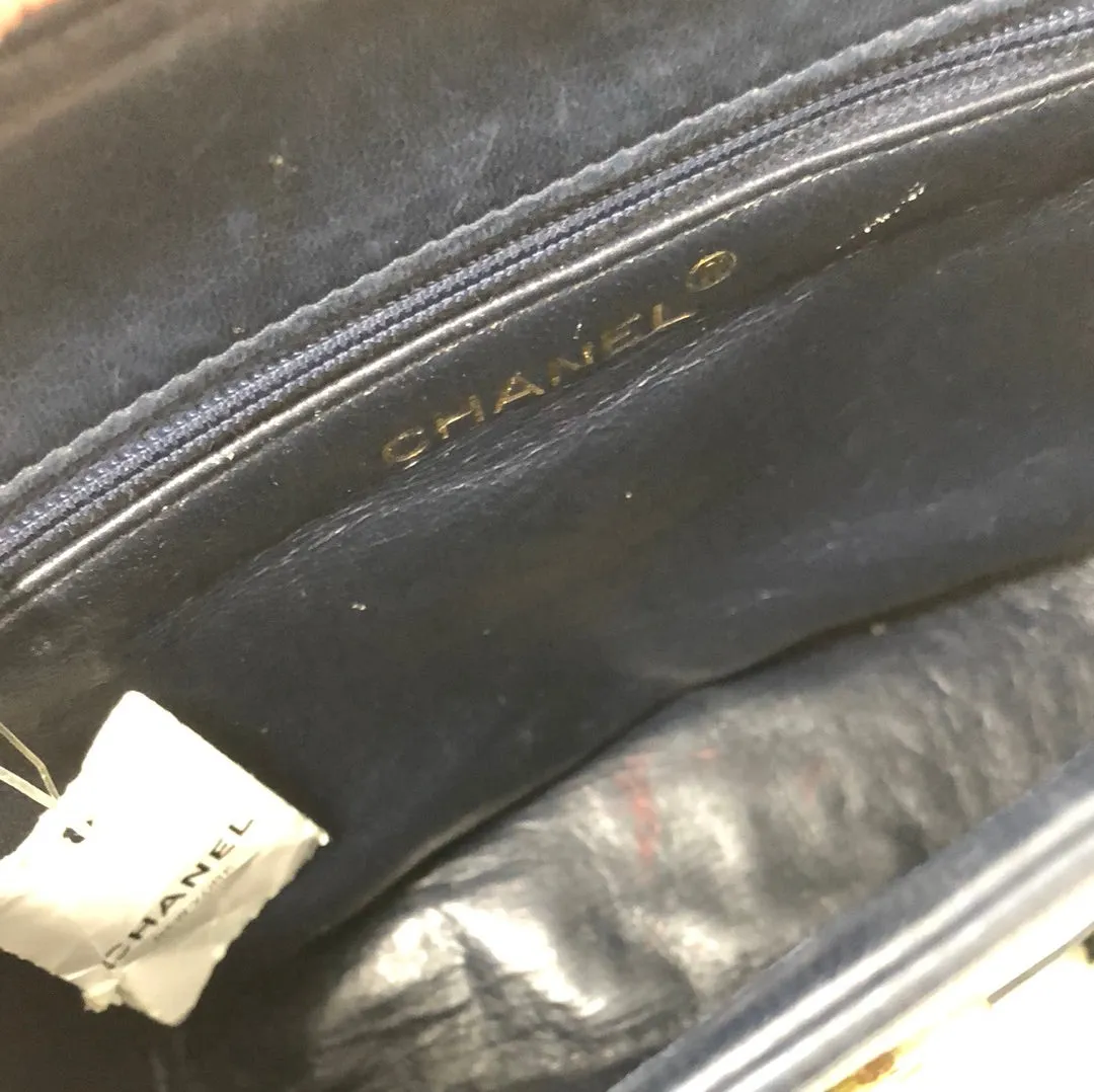 Vintage: Chanel navy lambskin top flab shoulder bag with gold hardware and tassle